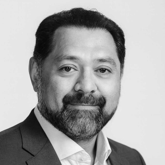 Portrait of Dr Dev Kumar, surgeon at Insight Surgery, smiling confidently.