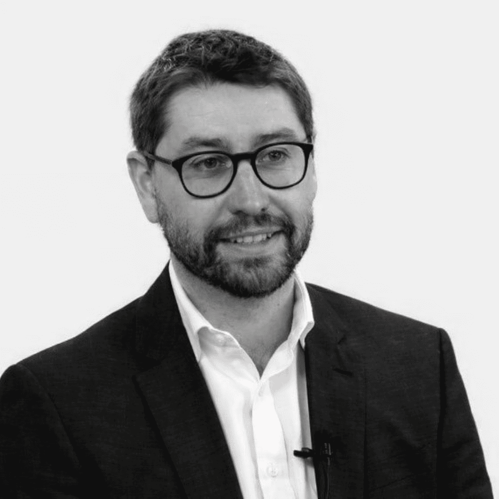 Surgeon Henry Pinchbeck smiling in a professional setting.