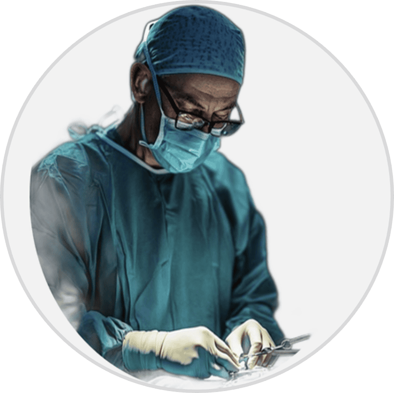 Surgeon in operating room with mask and gloves during surgery.